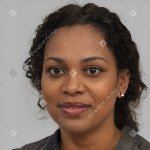 Joyful black adult female with medium  brown hair and brown eyes