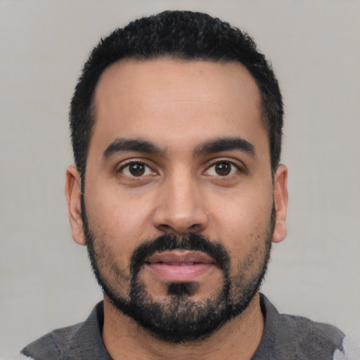 Neutral latino young-adult male with short  black hair and brown eyes