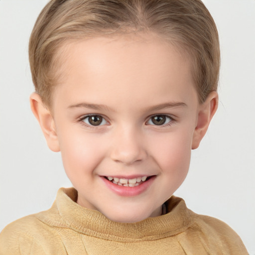 Joyful white child female with short  brown hair and brown eyes