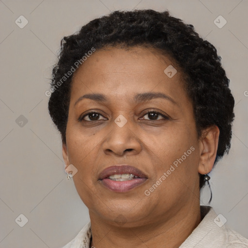 Joyful black adult female with short  brown hair and brown eyes