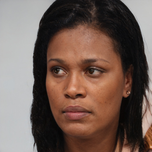 Neutral black young-adult female with long  brown hair and brown eyes