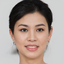 Joyful asian young-adult female with short  brown hair and brown eyes