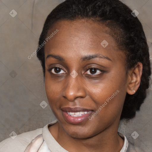 Joyful black young-adult female with short  black hair and brown eyes