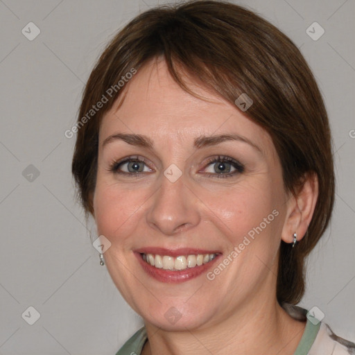 Joyful white young-adult female with medium  brown hair and blue eyes