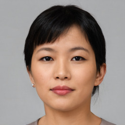 Neutral asian young-adult female with short  black hair and brown eyes