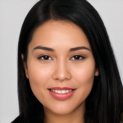 Joyful white young-adult female with long  black hair and brown eyes