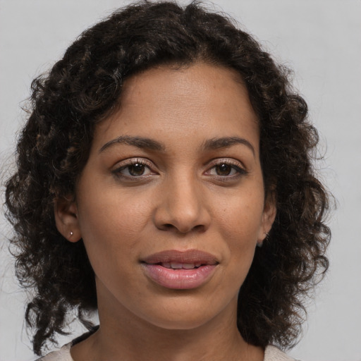 Joyful white young-adult female with medium  brown hair and brown eyes