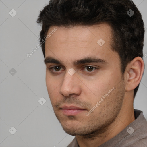 Neutral white young-adult male with short  black hair and brown eyes