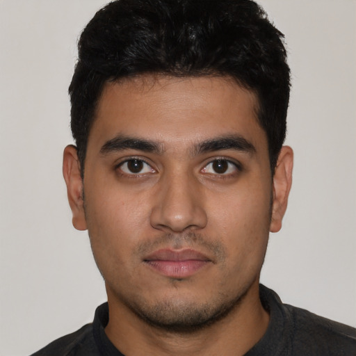 Neutral latino young-adult male with short  black hair and brown eyes