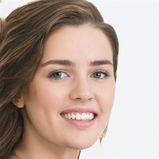 Joyful white young-adult female with long  brown hair and blue eyes