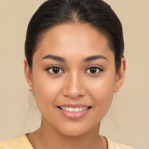 Joyful latino young-adult female with short  brown hair and brown eyes