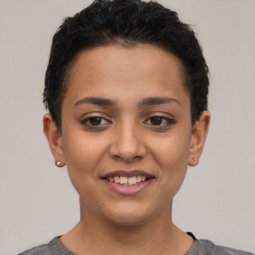 Joyful latino young-adult female with short  brown hair and brown eyes