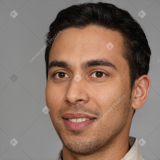 Joyful white young-adult male with short  black hair and brown eyes