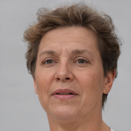 Joyful white middle-aged female with short  brown hair and brown eyes