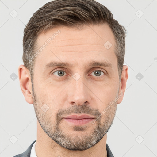 Joyful white adult male with short  brown hair and grey eyes