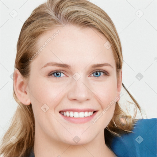 Joyful white young-adult female with long  brown hair and blue eyes