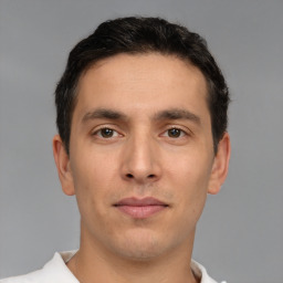 Neutral white young-adult male with short  brown hair and brown eyes