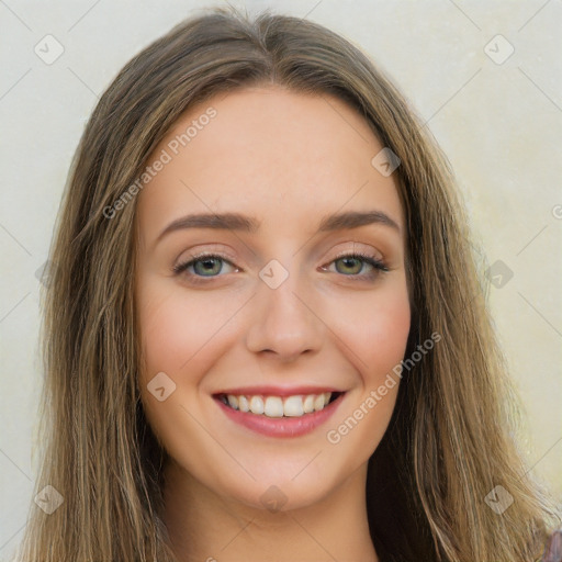 Joyful white young-adult female with long  brown hair and green eyes