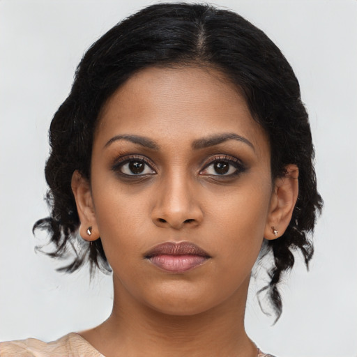 Neutral black young-adult female with medium  black hair and brown eyes
