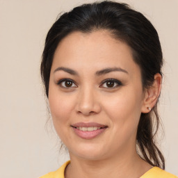 Joyful asian young-adult female with medium  brown hair and brown eyes