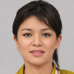 Joyful asian young-adult female with medium  brown hair and brown eyes