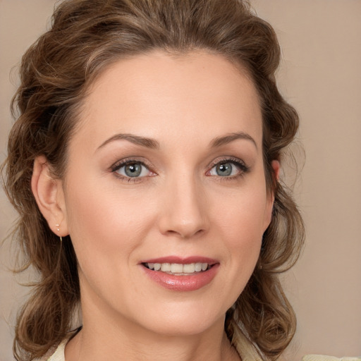 Joyful white young-adult female with medium  brown hair and green eyes