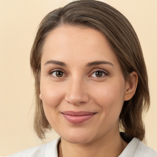 Joyful white young-adult female with medium  brown hair and brown eyes