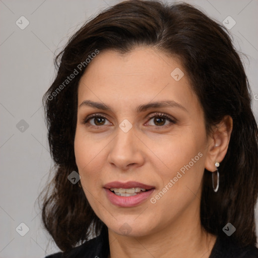 Joyful white adult female with medium  brown hair and brown eyes