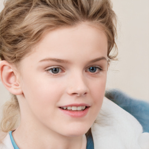 Joyful white child female with short  brown hair and blue eyes