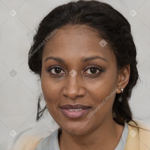 Joyful black adult female with medium  brown hair and brown eyes