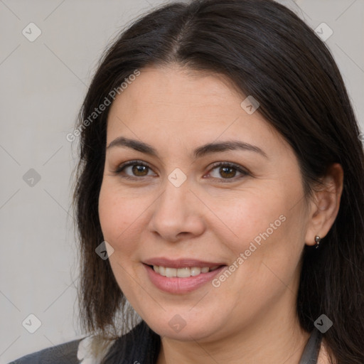 Joyful white adult female with long  brown hair and brown eyes