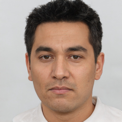 Neutral white adult male with short  black hair and brown eyes