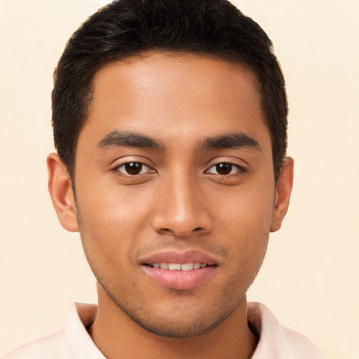 Joyful asian young-adult male with short  brown hair and brown eyes