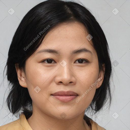 Joyful asian young-adult female with medium  brown hair and brown eyes