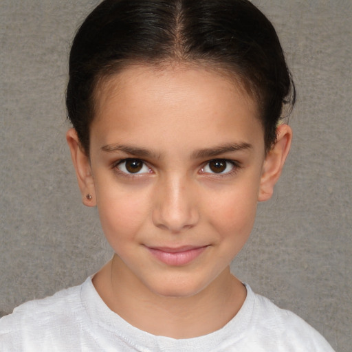 Joyful white child female with short  brown hair and brown eyes