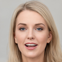 Joyful white young-adult female with long  brown hair and blue eyes