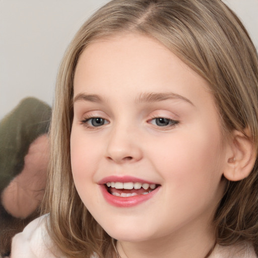 Joyful white child female with medium  brown hair and brown eyes