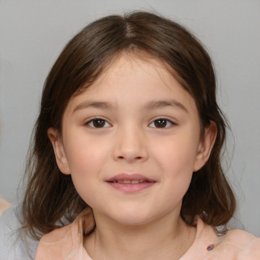 Joyful white child female with medium  brown hair and brown eyes