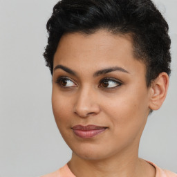 Joyful latino young-adult female with short  brown hair and brown eyes