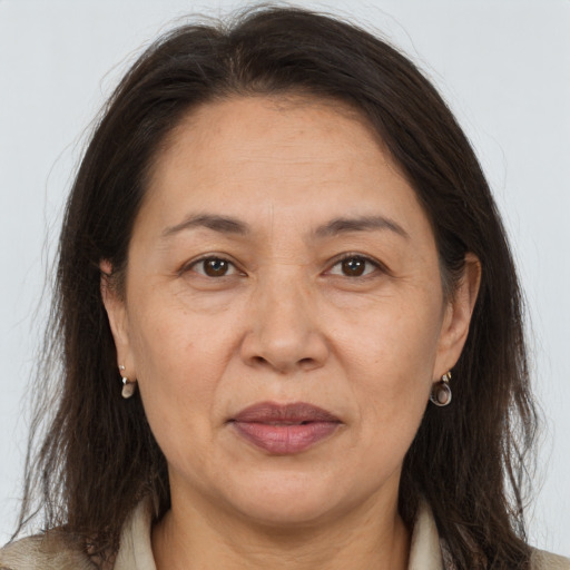 Joyful white adult female with long  brown hair and brown eyes