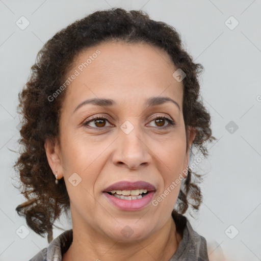 Joyful black adult female with medium  brown hair and brown eyes