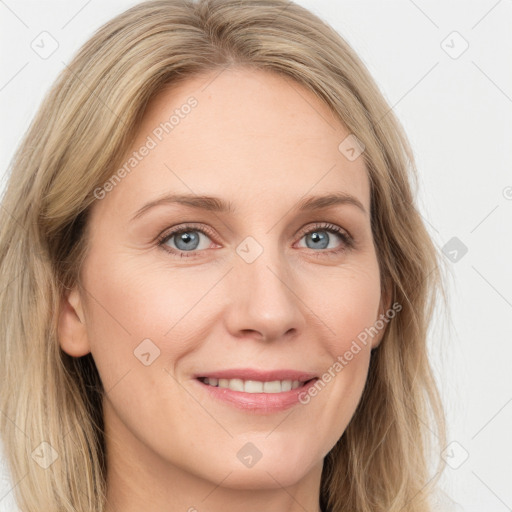 Joyful white young-adult female with long  brown hair and blue eyes