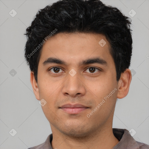 Neutral latino young-adult male with short  black hair and brown eyes