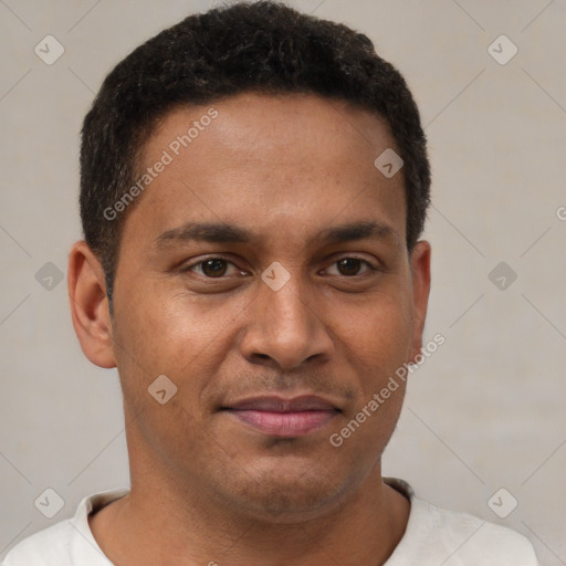 Joyful latino young-adult male with short  brown hair and brown eyes