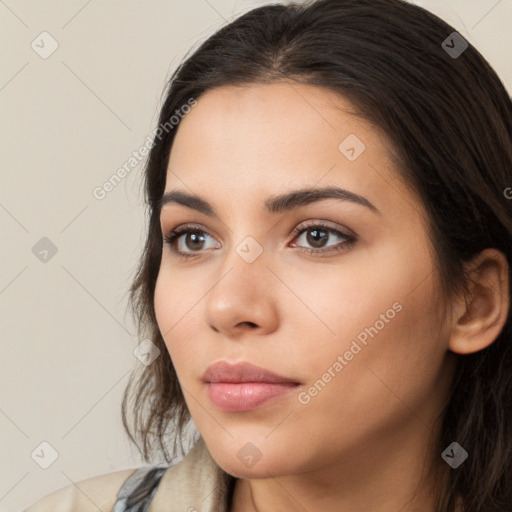 Neutral white young-adult female with long  brown hair and brown eyes