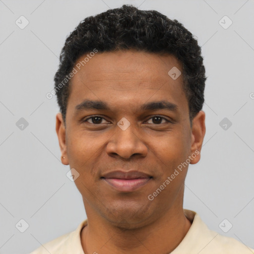 Joyful black young-adult male with short  black hair and brown eyes