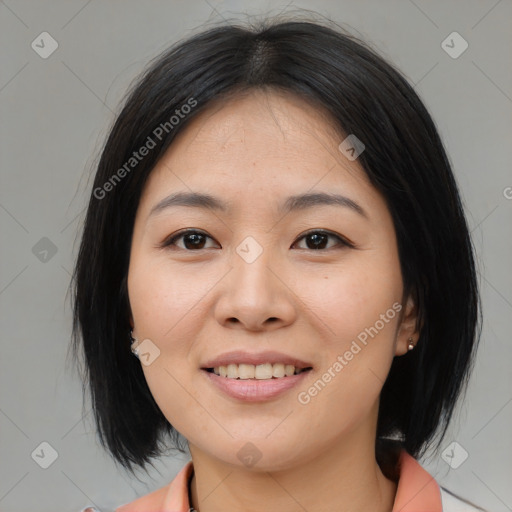 Joyful asian young-adult female with medium  black hair and brown eyes