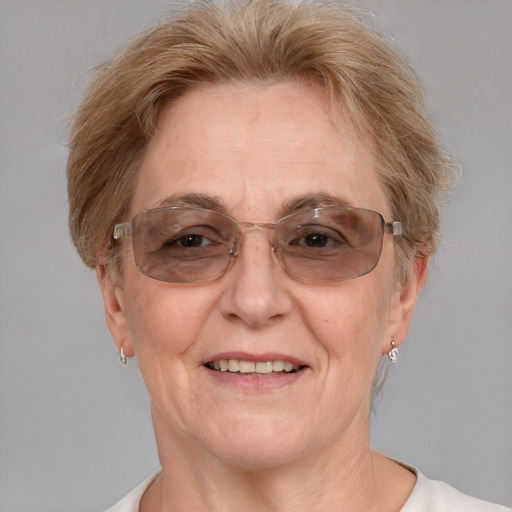 Joyful white middle-aged female with short  brown hair and blue eyes