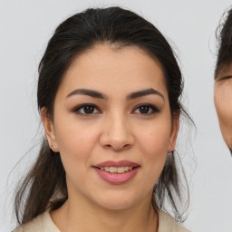 Joyful asian young-adult female with medium  brown hair and brown eyes