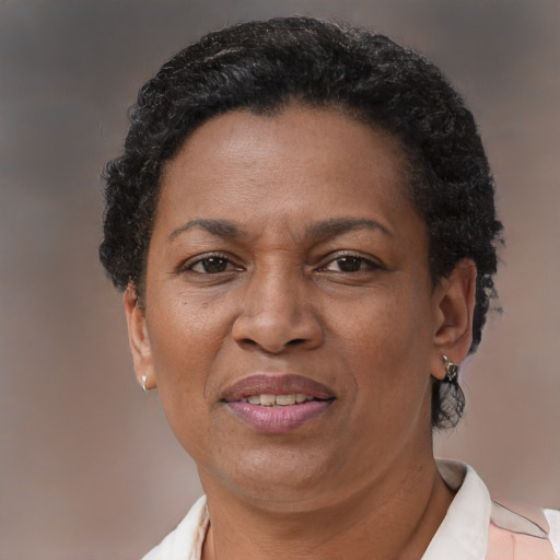 Joyful latino adult female with short  brown hair and brown eyes